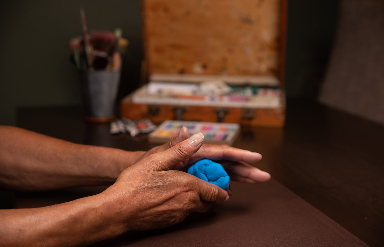 Image of hands molding clay