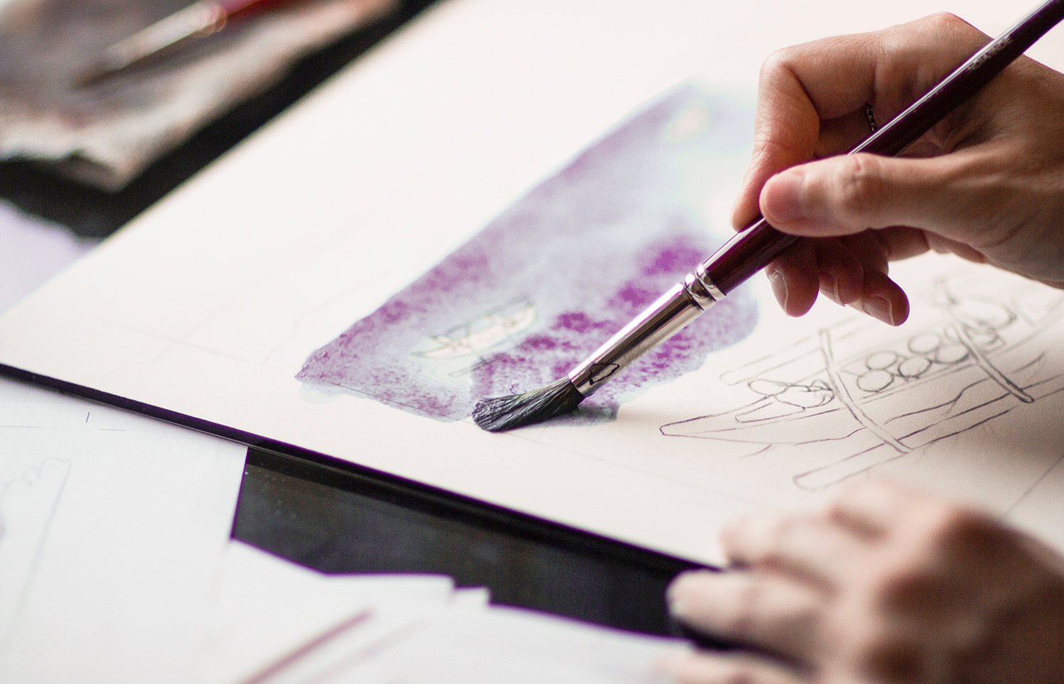 Image of hands creating a painting